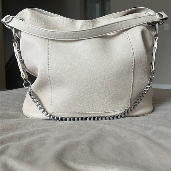 Madison West Purse in a purse
Cream purse w/ silver details. - Picture 1 of 6